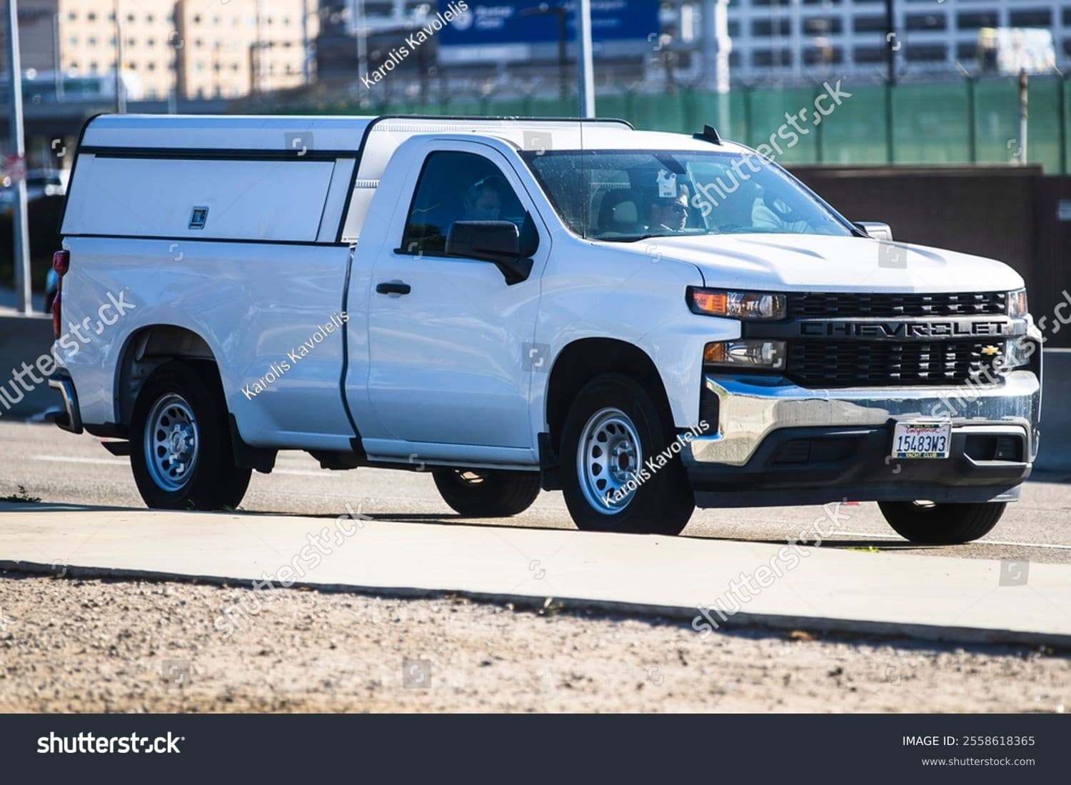 Chevrolet Silverado work truck with commercial cap