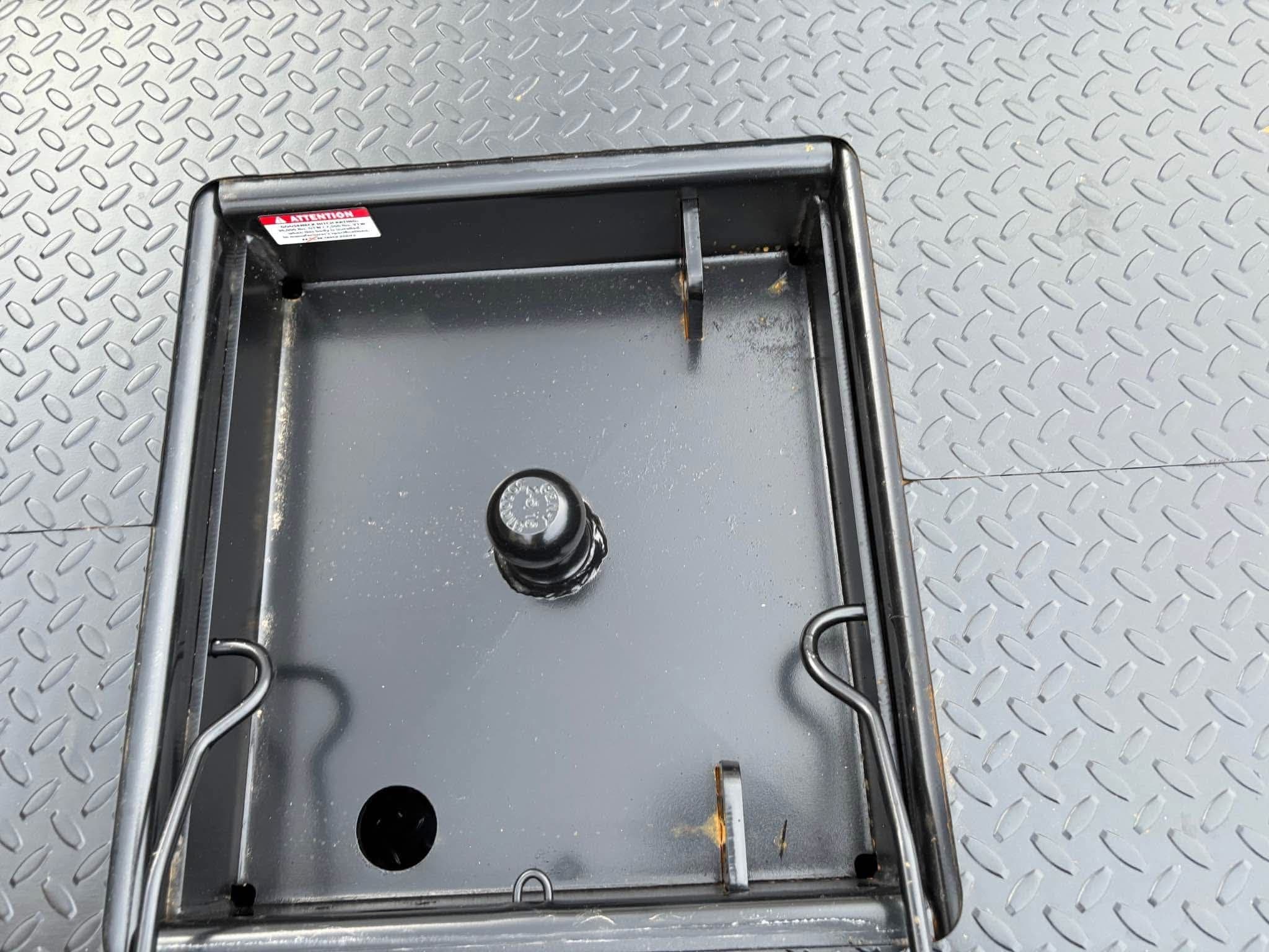 Close-up of the NXG flatbed gooseneck hitch ball recessed in the deck