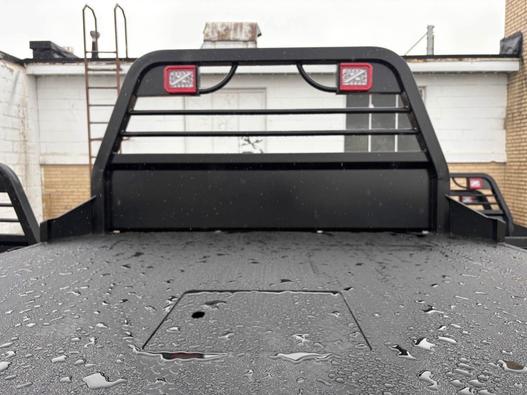 Front-facing view of the NXG XSD headache rack with LED clearance lights, seen across the wet deck